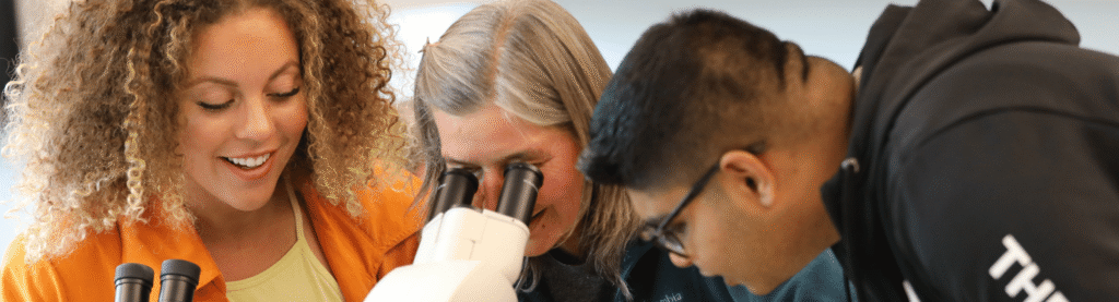 Students Viewing Microscope at OCCC