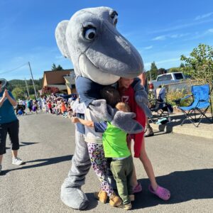 Waverly hugged by children