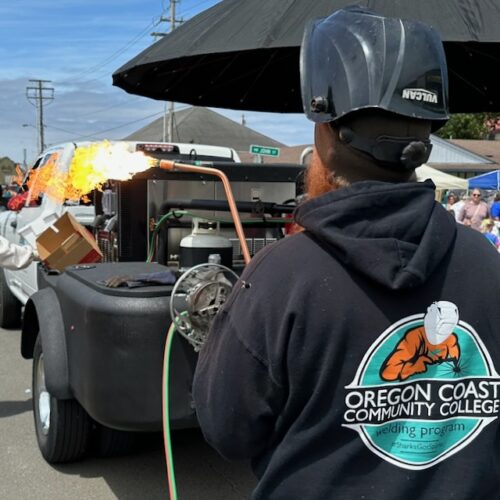 Welding student at a parade in Waldport