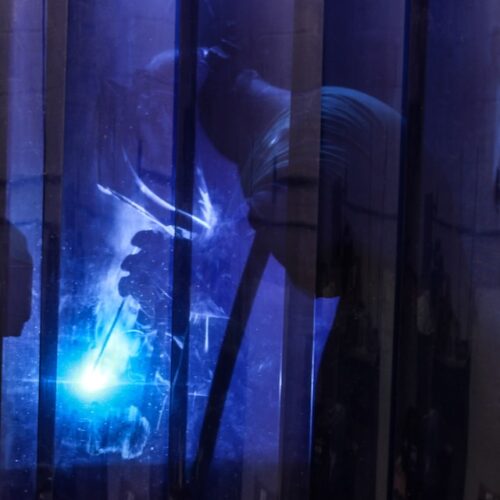 Welding student in a booth in Toledo