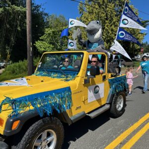 OCCC Parade Entry, featuring Waverly the Shark in a yellow Jeep