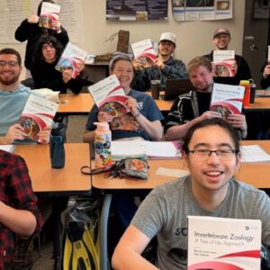 Students Smiling with Textbooks