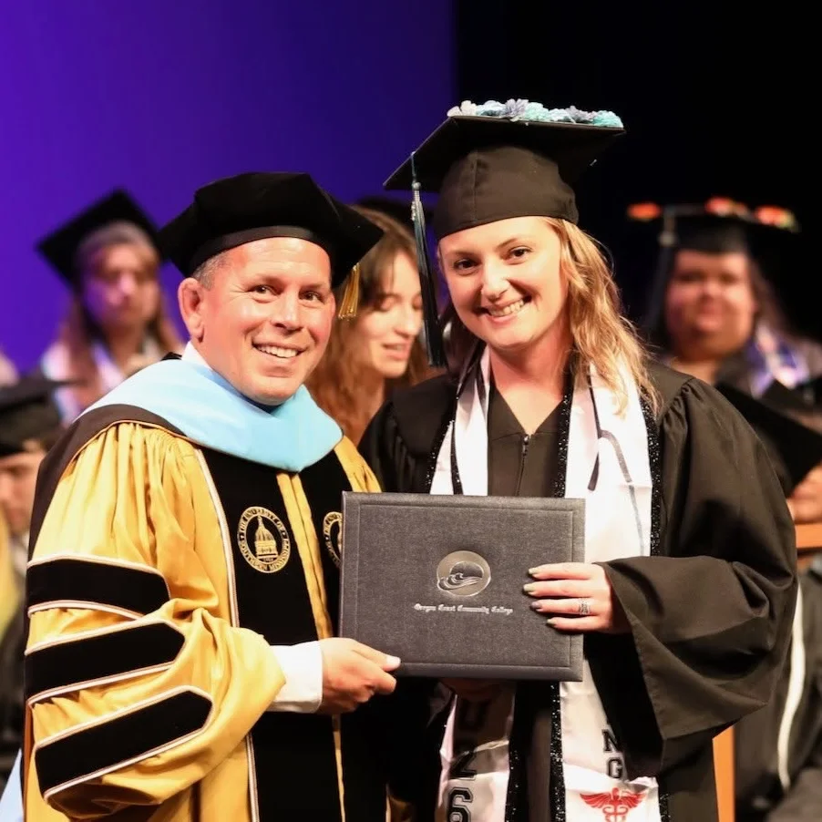 Graduation photo with President Marshall Mease Roache