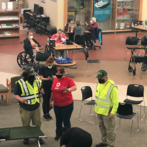 Staff gather to respond to fire evacuees